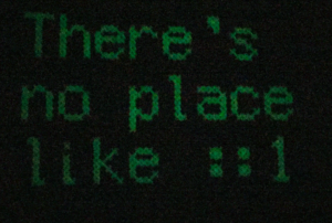 Glowing text that says "There's no place like ::1"